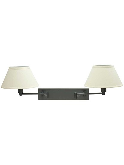 Finley Double Swing-Arm Wall Lamp in Oil-Rubbed Bronze.